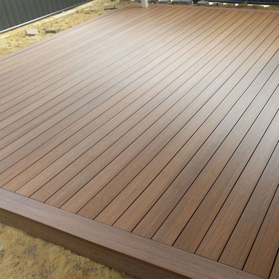 How do you prepare the ground for wood composite decking?